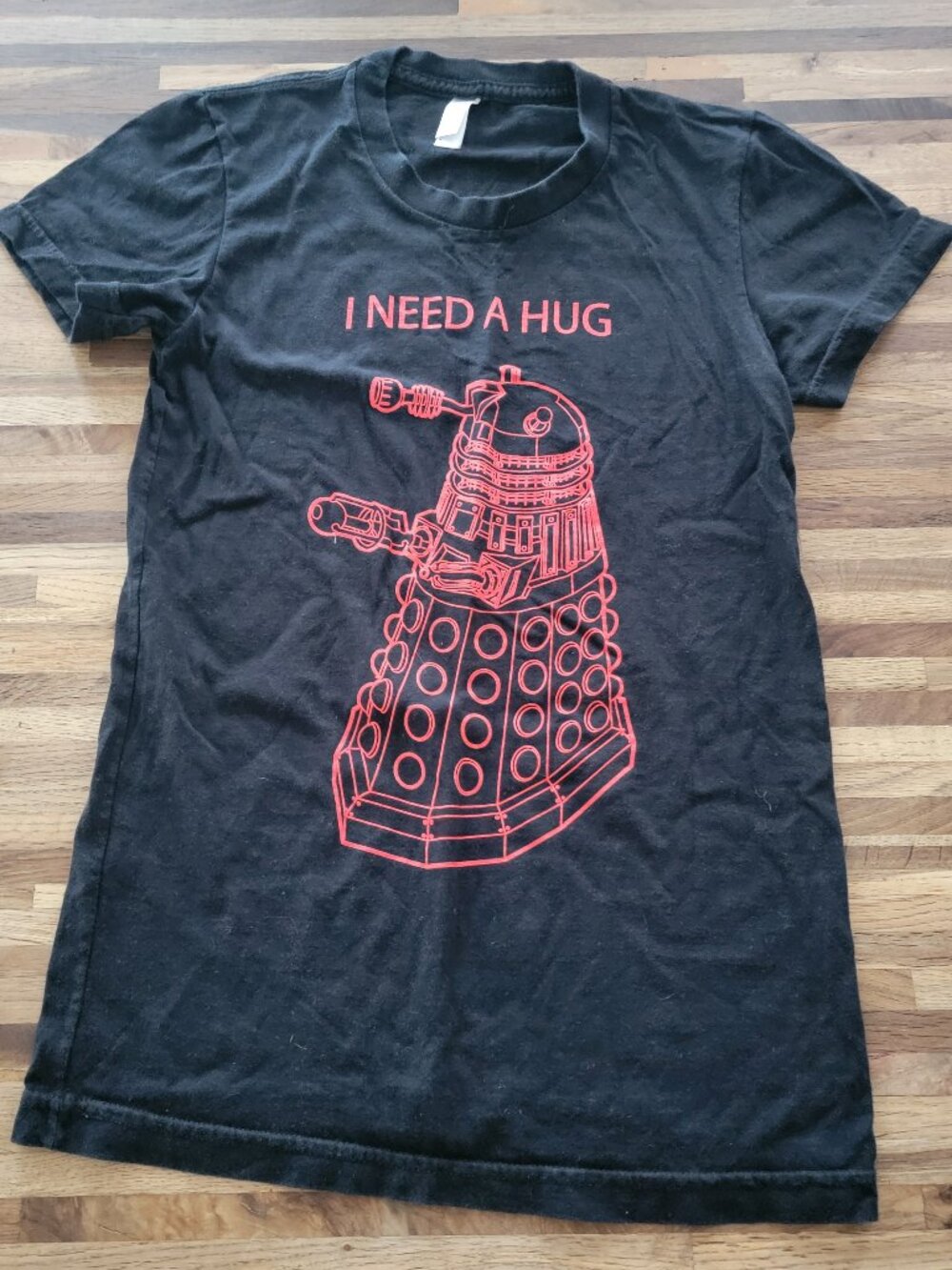 black Doctor Who I Need a Hug t-shirt featuring a red Dalek graphic